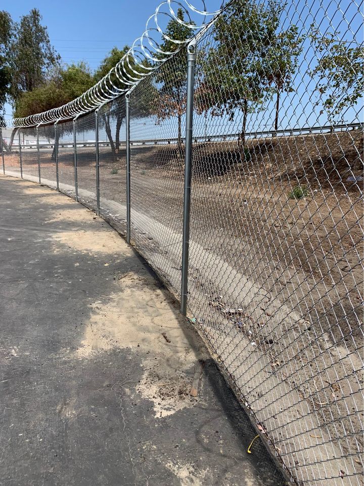 Commercial chain link with barbed wire Irving TX
